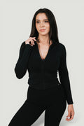 A N A M E black midnight long-sleeve Core Jacket with a front zipper, worn by a model against a neutral background.